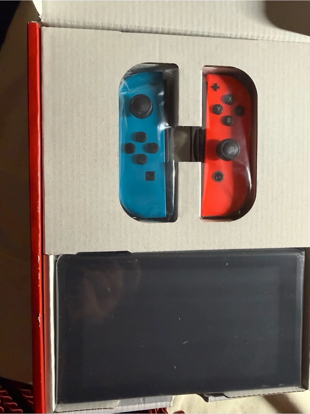 Nintendo Switch Console with Blue Left Joy-Con and Red Right Joy-Con